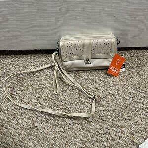 Cross body bag/wallet with adjustable straps can convert to a clutch